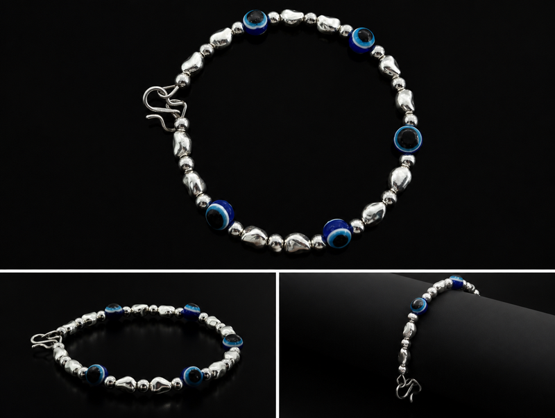 Silver bracelet with blue beads on a black background