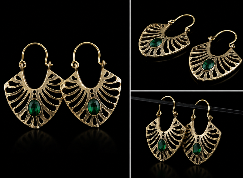 Gold earrings with green gemstones on a black background