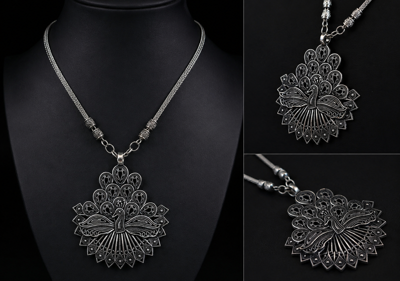 Silver necklace with intricate pendant on a black background